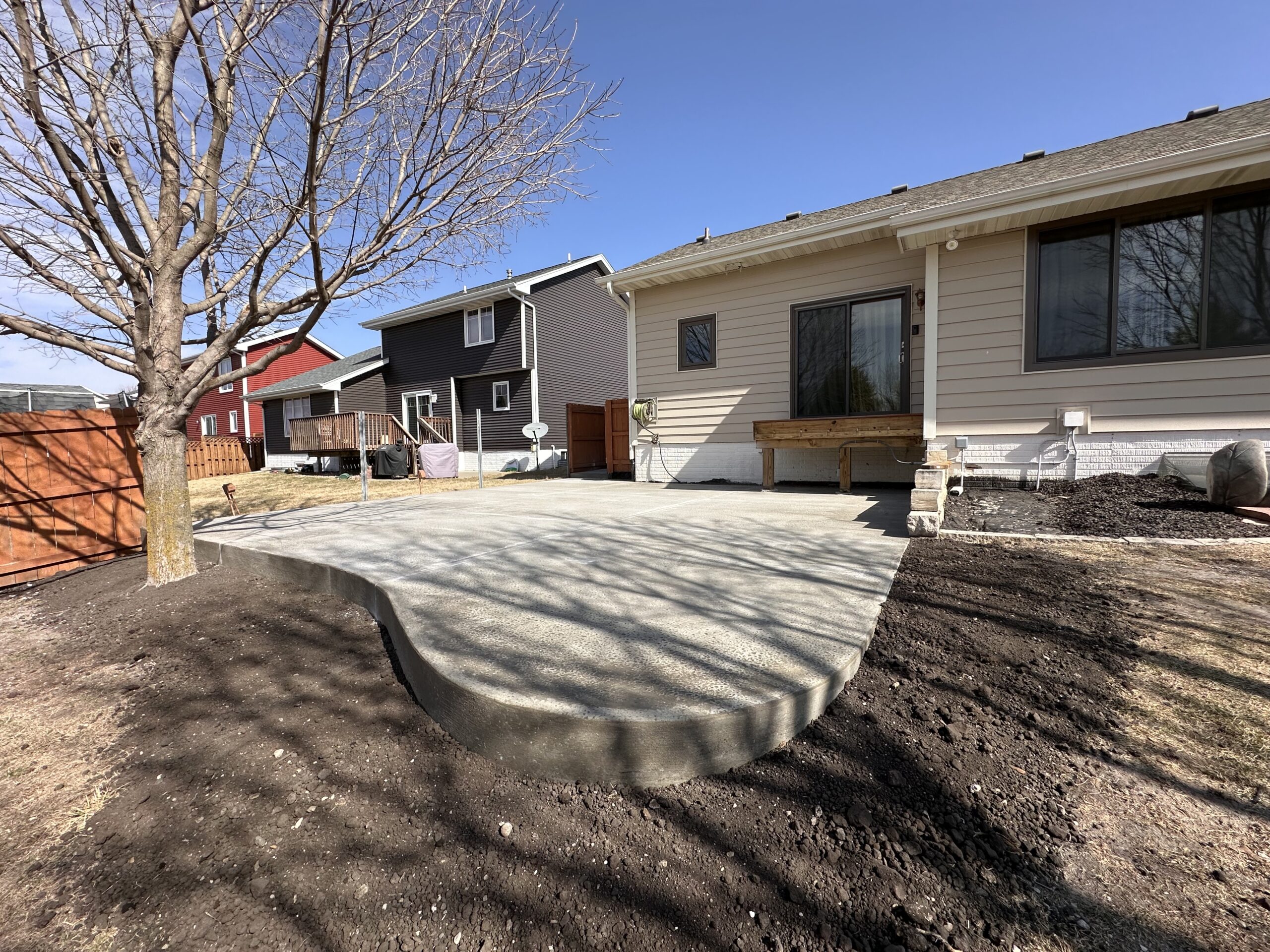 New concrete patio installed in Des Moines. Sidewalk replacement services.