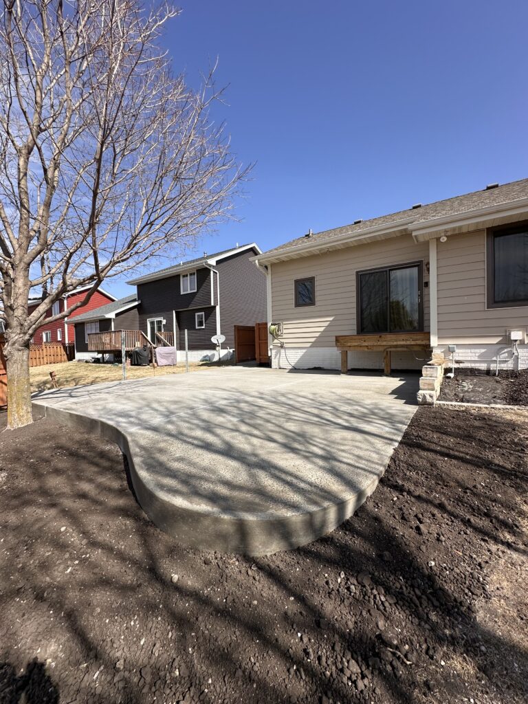 Stamped concrete patio in a suburban Des Moines backyard