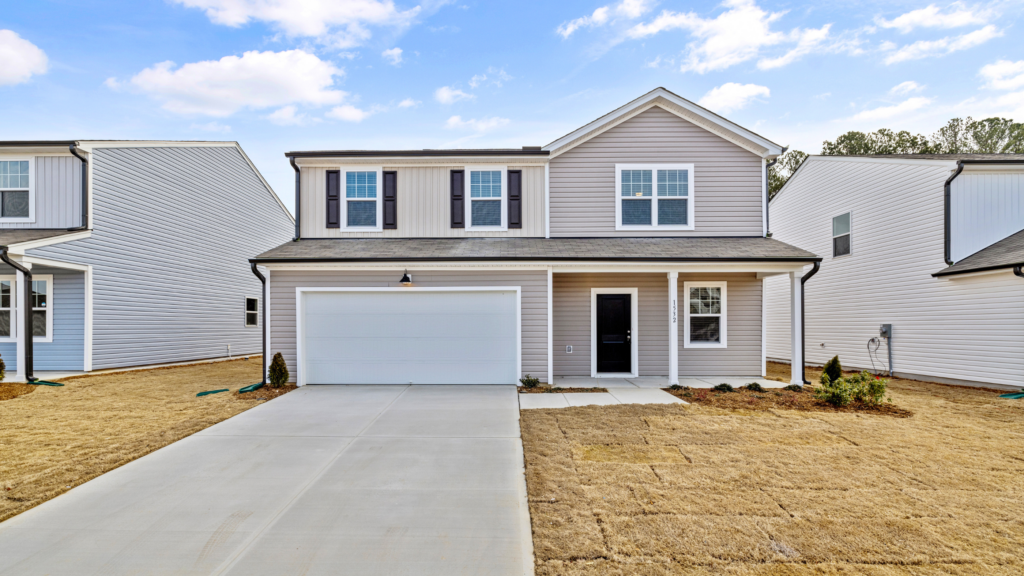 New home with concrete driveway, similar to Des Moines driveways.